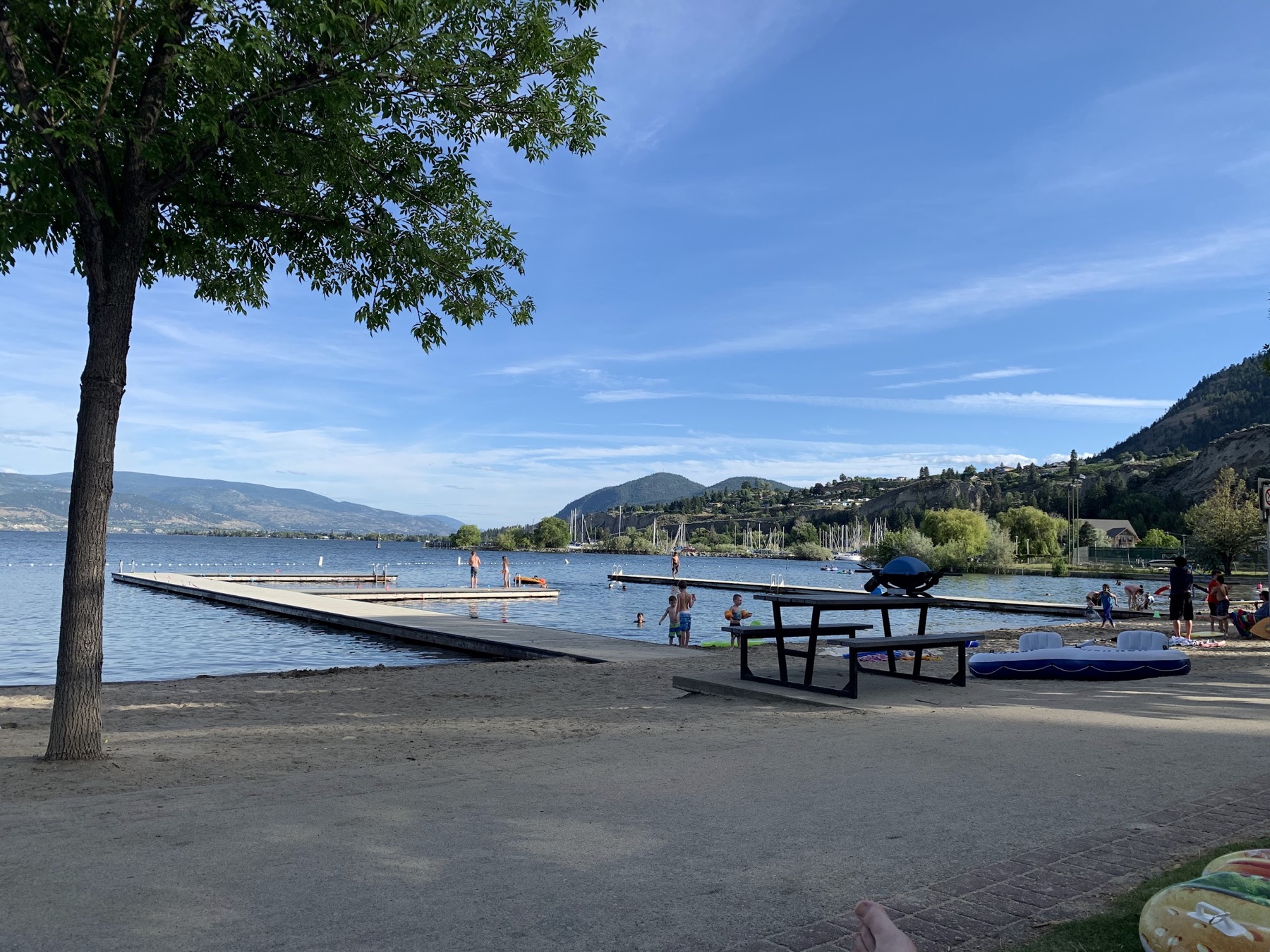 Summerland beach beside blue Okanagan Lake